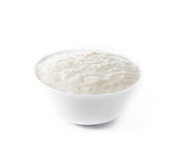 Rice pudding. Arroz con leche. Rice pudding in white bowl isolated on white background.