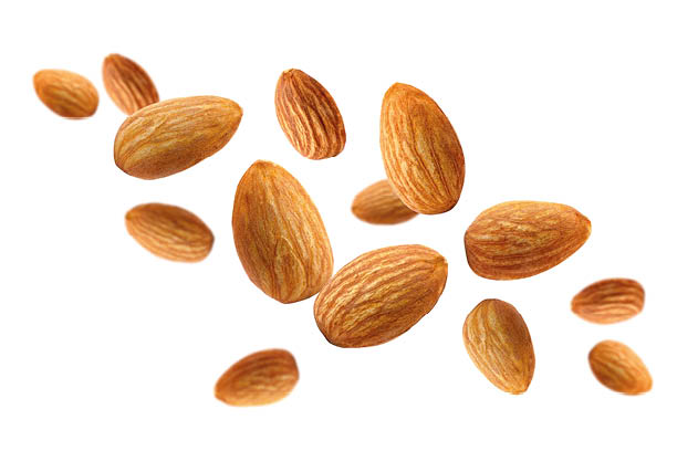 Almond nuts isolated on white background. Almond fly.