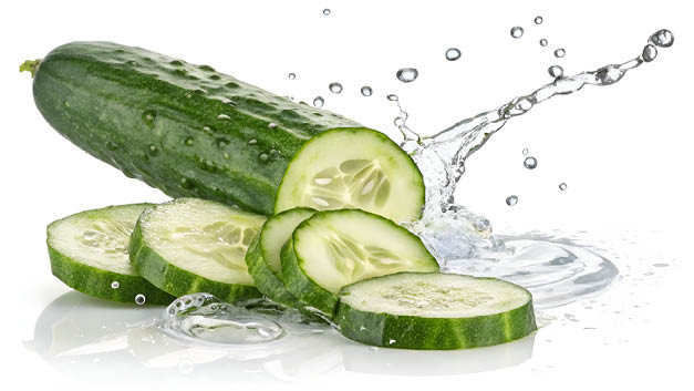 Floating Cucumber with Slices and Water Droplets Isolated on White