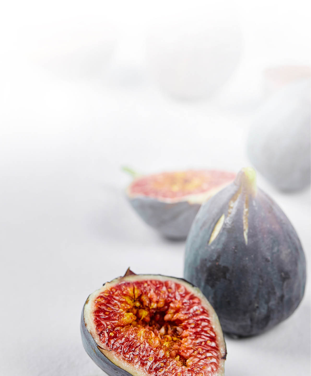 Whole fig and fig slices on a white background. High quality photo