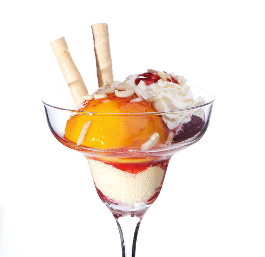 A cup of peach ice cream isolated on white background