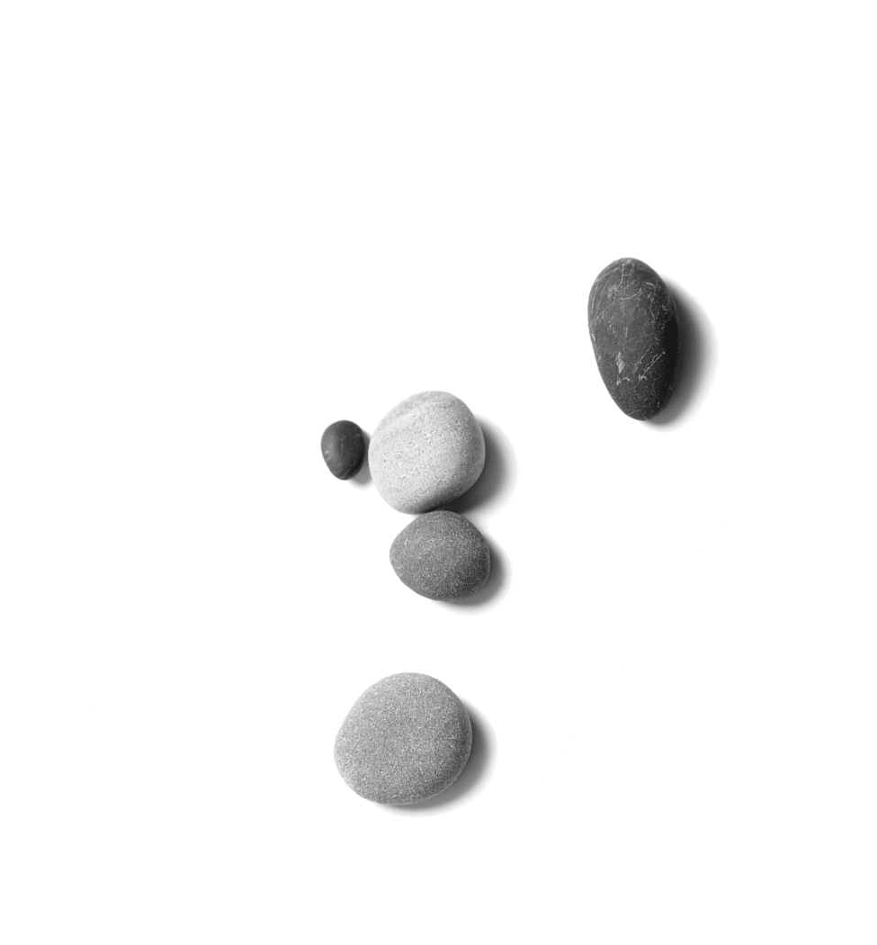 Scattered sea pebbles. Smooth gray and black stones isolated on white background. Top view