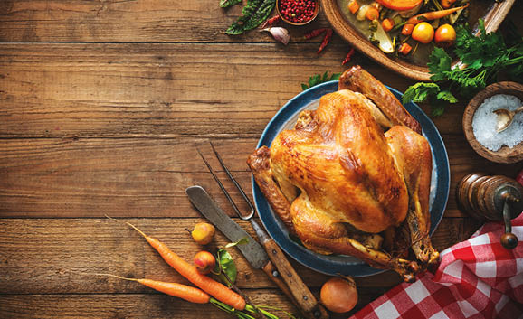 Christmas or Thanksgiving turkey on rustic wooden table