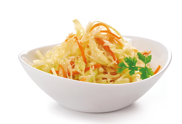 Cabbage salad with carrots, in white bowl