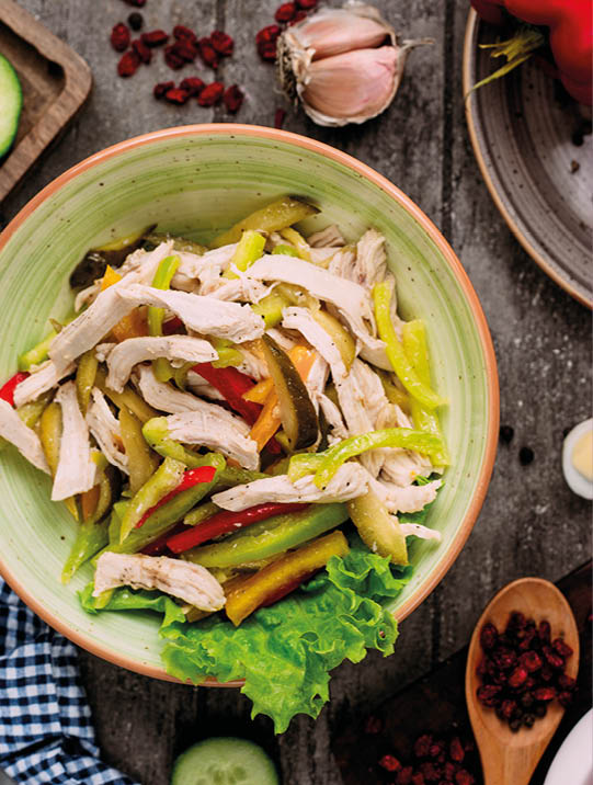 chicken salad with pickles top view on the table