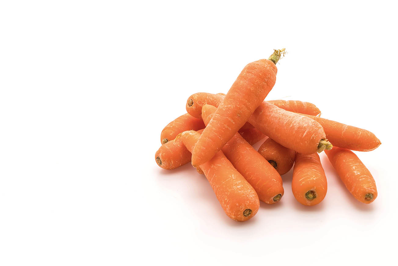 baby carrots on white background