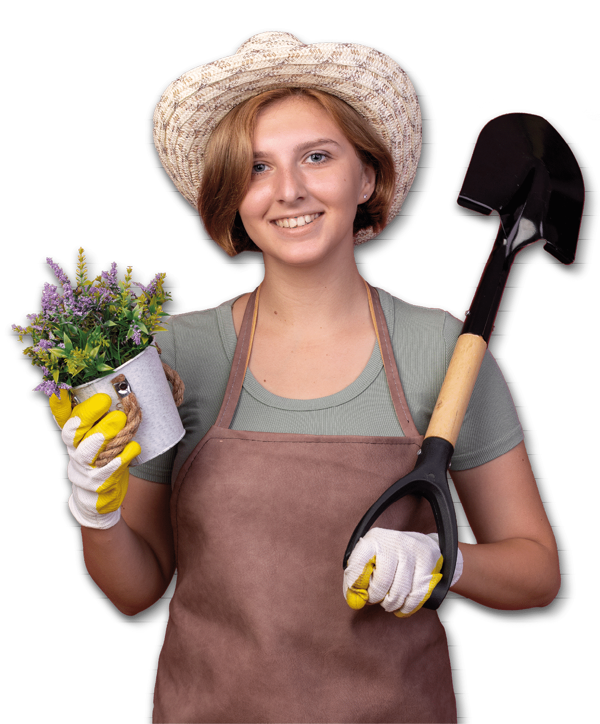 smiling young slavic female gardener wearing gardening hat and gloves holding flowers in flowerpot and spade isolated on pink background with copy space